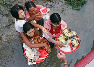 Selling fruit to ferry passenger on
Irrawaddy River, Myanmar (Burma)