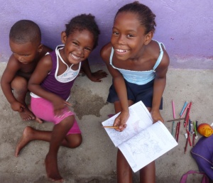 Schoolgirl with siblings on the
San Bernardo Islands, Colombia