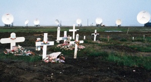 Cemetery in Barrow, Alaska with satellite
dishes pointing low toward southern horizon